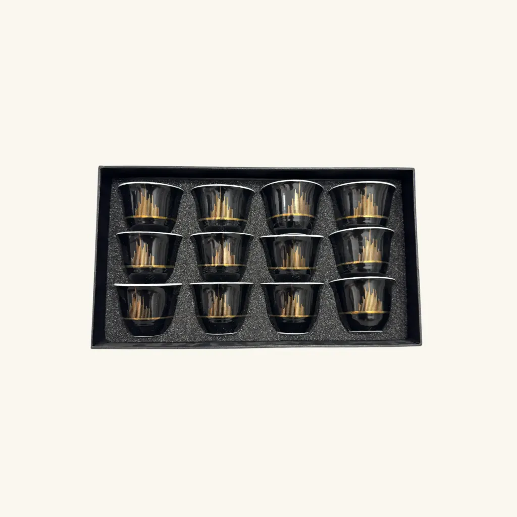 Black coffee cups with golden flowers